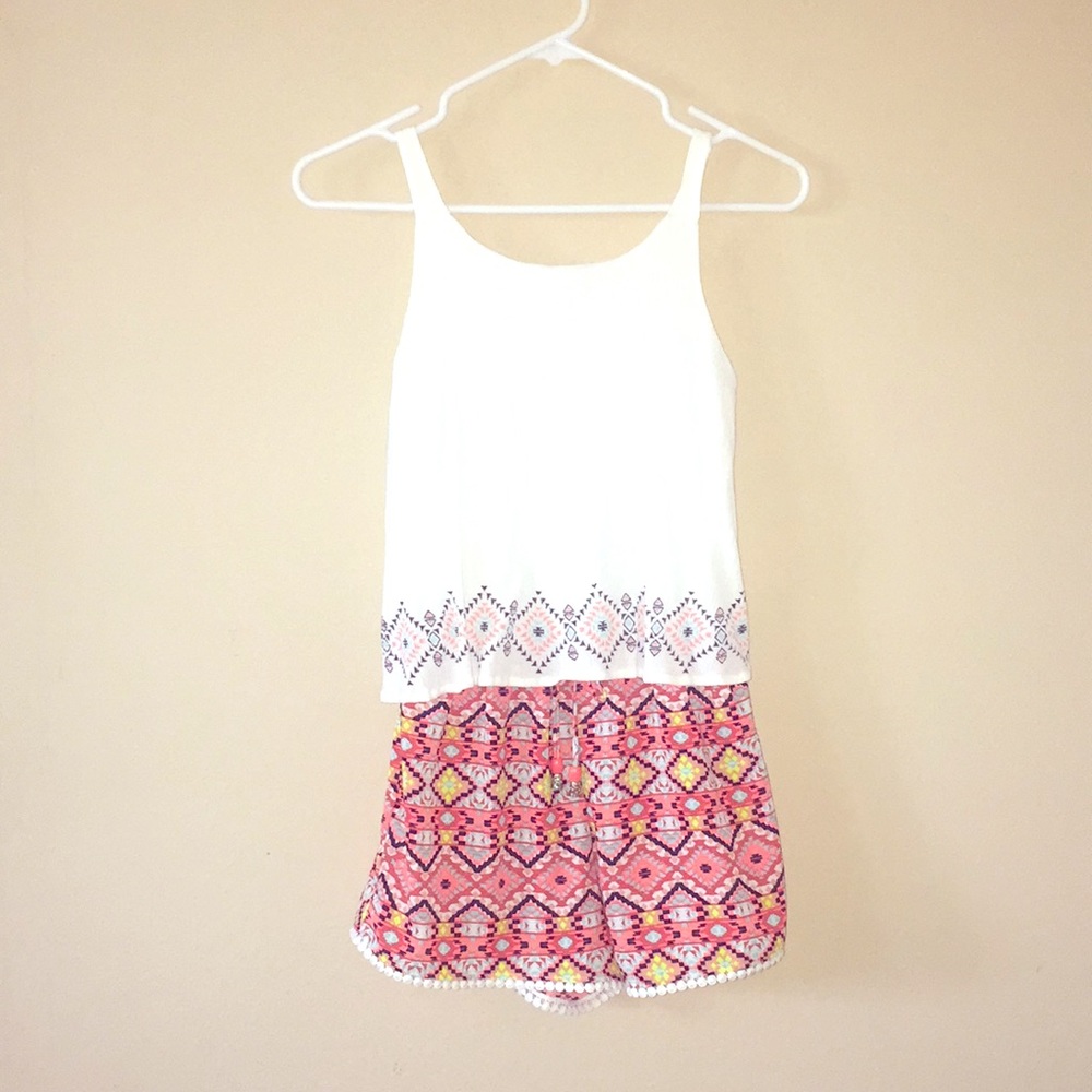 Colorful romper with cute designs. Kids large.